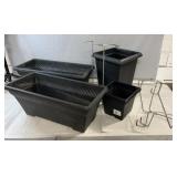 Collection of plastic planter pots and window