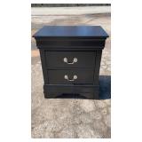 Black two-drawer nightstand with classic molded