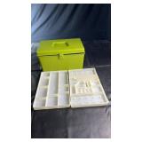 Green plastic storage box with hinged lid and