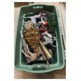 Green plastic storage tote filled with Christmas