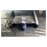 Adjustable footrest with textured surface and