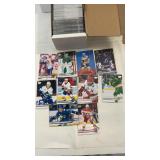 Collection of four filled trading card storage