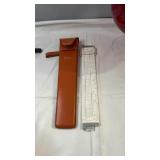 Slide rule with metal body and detailed
