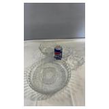 Clear glass serving pieces including a large