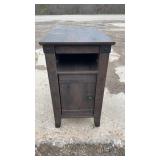 Dark wood side table with lower cabinet door and