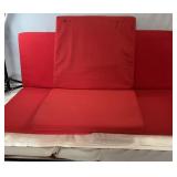 Set of three red seat cushions with removable