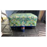 Upholstered footstool featuring a vibrant