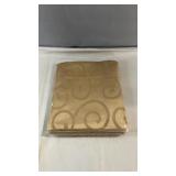 Gold-tone tablecloth with an elegant scroll