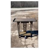 Green-toned accent table featuring decorative