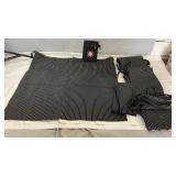 Five Black pinstripe server aprons with matching
