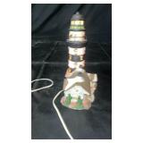 Decorative lighthouse table lamp featuring a