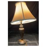 Table lamp with dark metal finish and beige