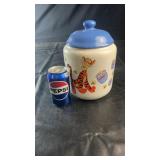 Winnie the Pooh ceramic cookie jar with blue lid,