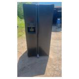 Black Frigidaire side-by-side refrigerator with