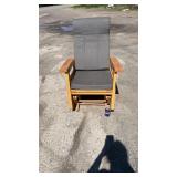 Wooden glider rocking chair with padded seat and