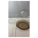three Pyrex glass pie plates including two clear