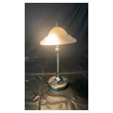 brass-tone table lamp with frosted glass