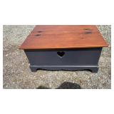 Wooden storage chest featuring a two-tone finish