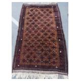 Baluch rug - burnt red orange white