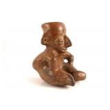 Colima seated hunchback seated figure