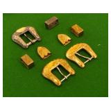 3 gold and silver Western belt buckles