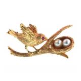 Vintage 14 karat gold pendant of a bird and nest
