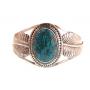 A Navajo Royston Turquoise Bracelet with feathers