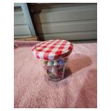 Checkerd Top Jar Of Marbles