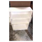 White pressed wood bookshelf