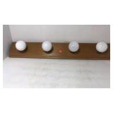 Vanity light bar. Wood