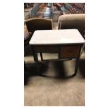 Porcelain top kitchen table/island has two slid