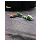 Metal toy tractor with wagon and a metal semi