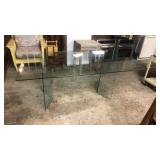 Glass table. Legs have few chips in it.