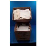 2 boxes of linens 2 boxes of linens