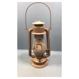 Rusty metal lantern. Cracked glass Rusty metal lantern. Cracked glass