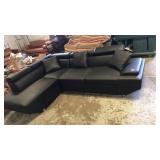 Black sectional with pullout bed and pillows new. Black sectional with pullout bed and pillows new.