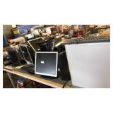 Table of working computers towers and keyboards