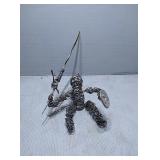 Metal art person with sword