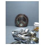 Plastic tub of silverware, anniversary plate, and