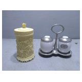 Salt and pepper shakers with holder and a plastic