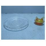 Small hen on nest and chicken plate