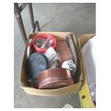 Box of tin containers, bottles, and more