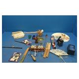 Flat with spoons, fans, tin cup, and more