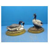 2 goose statues