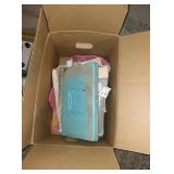 Box with blue box full of zippers and more