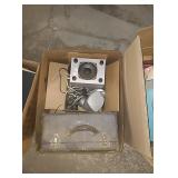 Box with brief case, speakers, and more