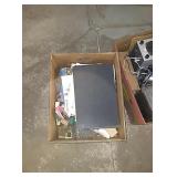 Box with paper goods, light bulb, wire, and much