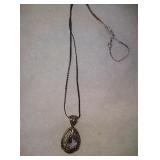 Sterling silver necklace with purple gem