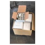 Box of white ceramic lightbulbs