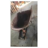 Large rusty wheelbarrow